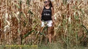 Pee in a corn field - Crossing her legs to calm her full bladder and wet her jeans in the heat outdoor