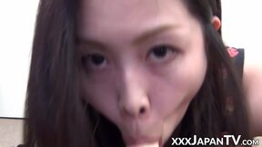 Handsome Oriental vixen stuffs mouth with plastic dick