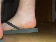 Giant boy in flip flops