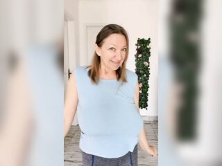 Hawt GILF teasing by giant melons
