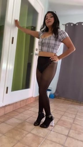 Tiny skirt in heels with sexy black pantyhose