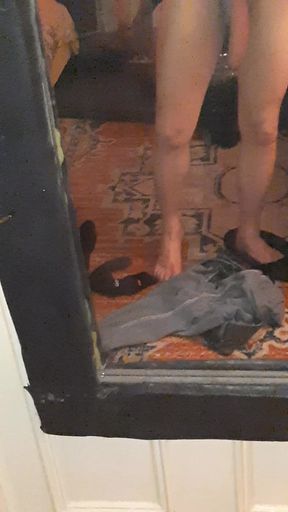 Dangling dick shot in front of a full length mirror