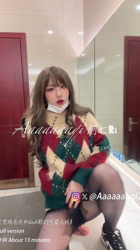 Transvestite Ah Qi "cute Shemale in Wide Sweater and Duck Shoes in Public Toilet"