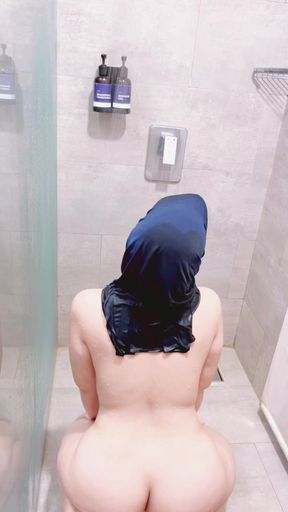 Indonesian girl taking a shower in traditional clothes