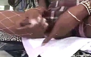 Nefertiti strokes her long black cock.