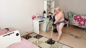 Mother-in-law vacuums the room naked