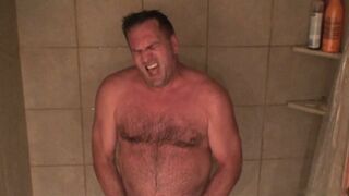 Watch this hot amateur guy give a wild handjob and blow his lucky dad in the bathroom