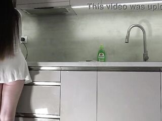Recent wife sexy brunette hair sweetheart with large melons large booty in the kitchen with a short white transparent costume shows what that babe has