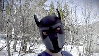 Cute dude with a wolf mask films himself talking outdoors