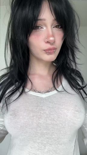 Woman with short hair and piercings