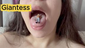 A giantess humiliates her tiny husband by taking it into her mouth and sucking it like a delicious candy, then playing with it and sticking it in his nose, pretending to have a piece of dirt in his nose. Then she puts it between her big breasts to ma