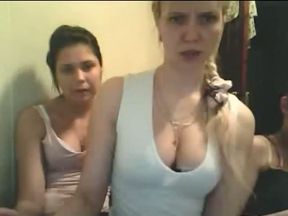 Two naughty blonde and brunette girls were posing in their white tank tops