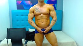 Dennis Poses in Blue Briefs