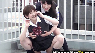 NipponPissTV.com - Outside pissing competition with two young Japanese pupils on camera