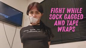 Transparent tape wraps with big sock gagged fight and moan begging using a tight shirt and boob reveal till remove