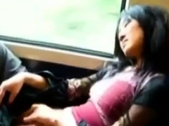 Asian milf rubs her clit on a train.
