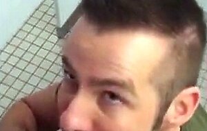 Handsome guy sucks dick in restroom stall