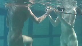 Two lovely white fresh girls playing in the pool nude