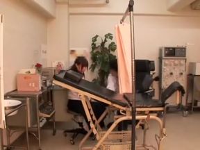 The gynecologist inspects an asian pussy by fingering it