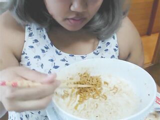 Cute feedee eats noodles for her feeder