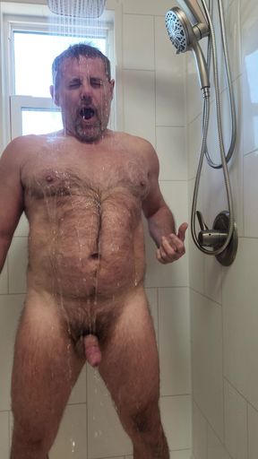 Handsome hairy daddy installs a new shower head, gets soapy, wet and cums!