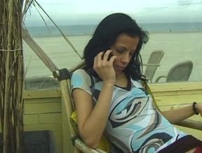 Hot chick with small tits talks on the phone