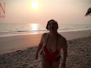 Nice lady at lonely nudist beach. Red swimsuit. Red bikini. Coconut
