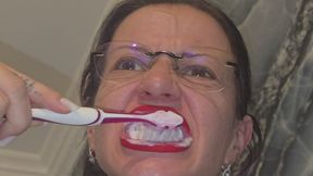 I brush my teeth, showing the inside of my mouth.