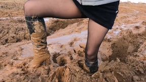 MUDDY PREMIERE: Emily walks in deep sticky mud on high heel leather boots