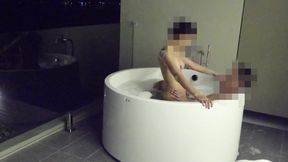 Asian couple having sex in an outdoor jacuzzi, someone is peeking.