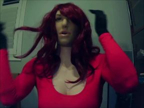 Redhead Reni’s silicone pussy and fake tits squirm under mask while she masturbates in yoga pants