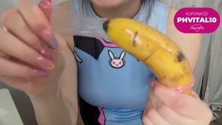 My stepsister  puts a condom on the banana, plays with it, then sticks it in a fake pussy