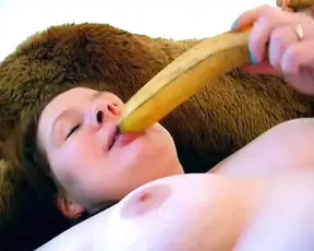 A hot German BBW enjoys rubbing her shaved twat on the bed