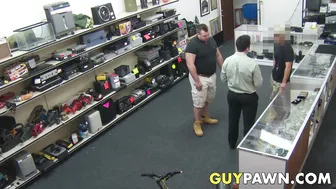 Pawnshop owner fucks his customer over the counter in anal threesome