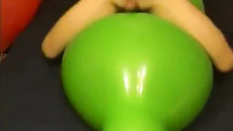 Twink rides large green balloon sex toy and cums hard