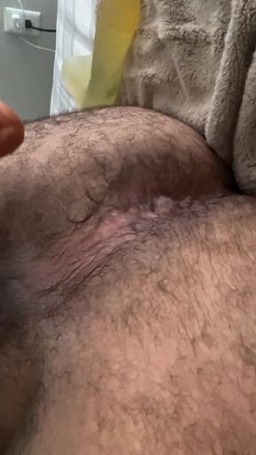 Greedy hairy bear picks out his biggest dildo to pleasure himself.