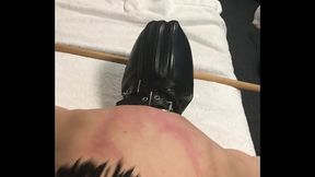 flogged strapped down on bench - hooded