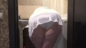 A home camera watches a mature wife. A curvy MILF behind the scenes. PAWG.