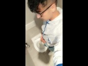 Twink with fat uncut cock piss at a rest stop toilet