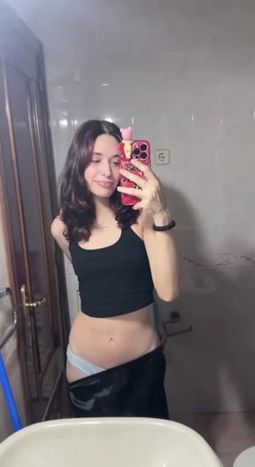 Slim teen teases her petite tits in a nude solo scene