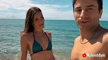 Sexy brunette wife gives beachside BJ in her bikini