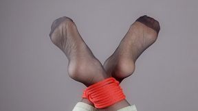 Tied Feet In Black Stockings