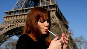 Natasha enjoys a cigarete at Eiffel tower
