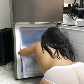 Filming the voluptuous maid cleaning the fridge