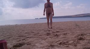 Walking naked out of the sea at nudist beach - Rockard Daddy