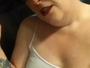 Pierced Kitty is chain smoking in bed with wine and a hookah
