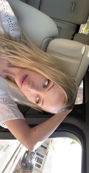 Blonde woman in car