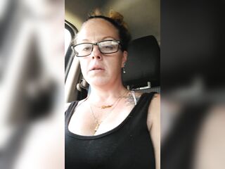 Cutie films up her own ebony minidress and teases with her pants in public whilst I'm driving