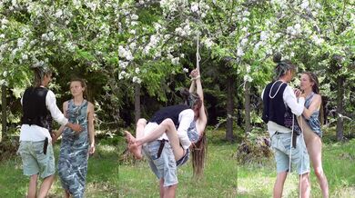 Shibari tie and soft kink under blooming apple tree in Sweden