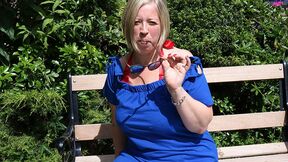 Chubby mature lady playing with her beaver in the garden